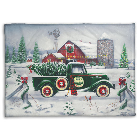Coral fleece blanket with a vintage truck and barn design.