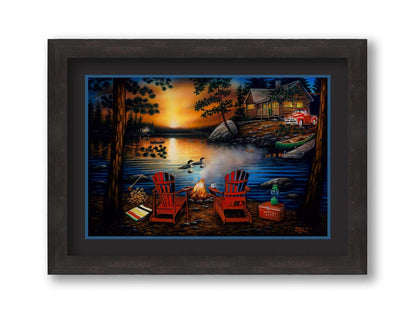 A painting of Kakagi Lake in Ontario, Canada. Cabins sit on the shore by docks of canoes used by fishermen. In the foreground, lawn chairs sit by a campfire. Printed on paper, matted, and framed.