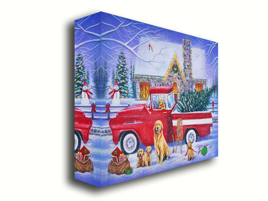 A painting of a red truck, parked in the snow outside a stone house decorated with Christmas lights. An evergreen is in the bed of the truck, and a family of golden retrievers sit in and around the vehicle. Printed on canvas.