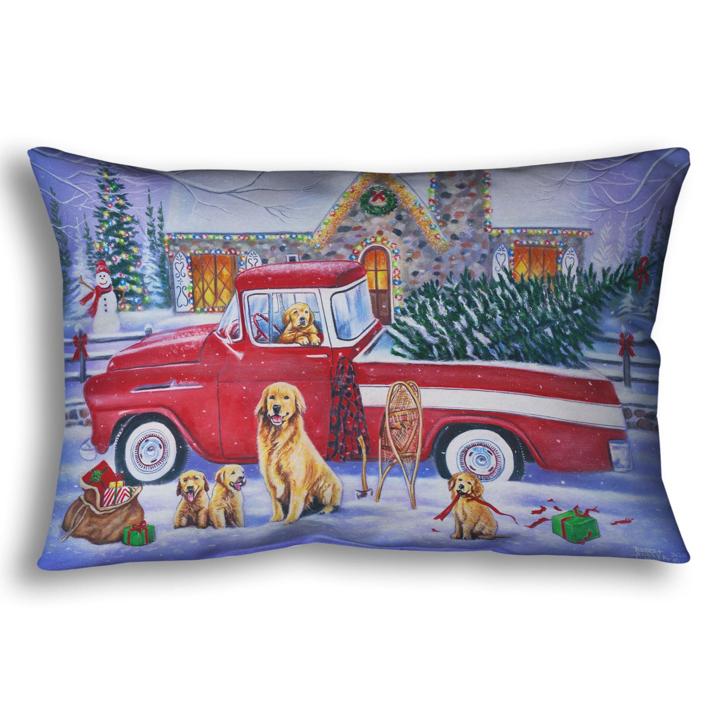 A throw pillow printed with a painting of a vintage red truck carrying a Christmas tree to a decorated house, surrounded by a family of golden retriever dogs.