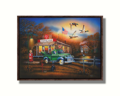 A painting of a "Country Store" and gas station, with a small house in the background. A small pond, with a sign reading "Mallard Lake," is beside it. A little green truck is parked in the front, carrying a green kayak. A black dog sits nearby, watching three mallard ducks fly overhead. Printed on canvas in a float frame.