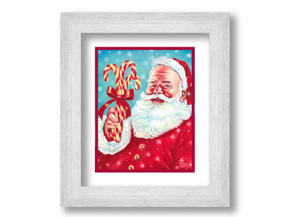 Illustrative painting of Santa Claus smiling and holding candy canes against a a blue snowing sky. Printed on paper, matted, and framed.