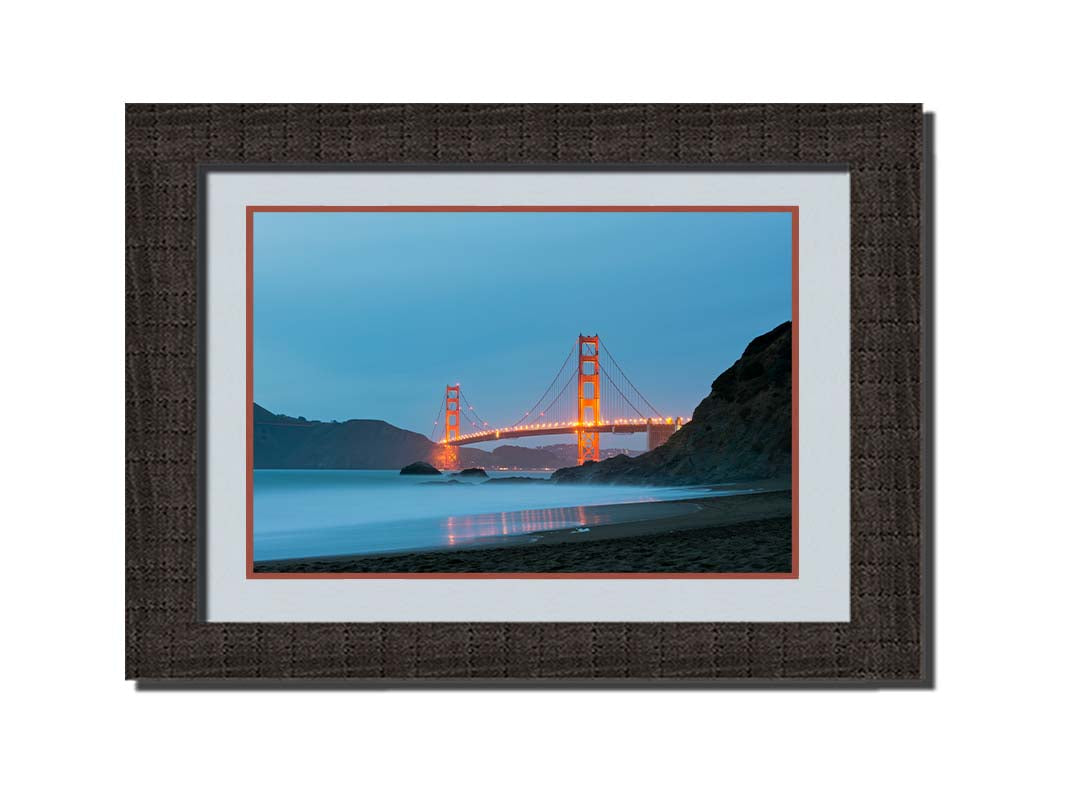 Photo at Baker Beach, San Francisco, looking out over the water at the Golden Gate Bridge. Printed on paper, matted, and framed.