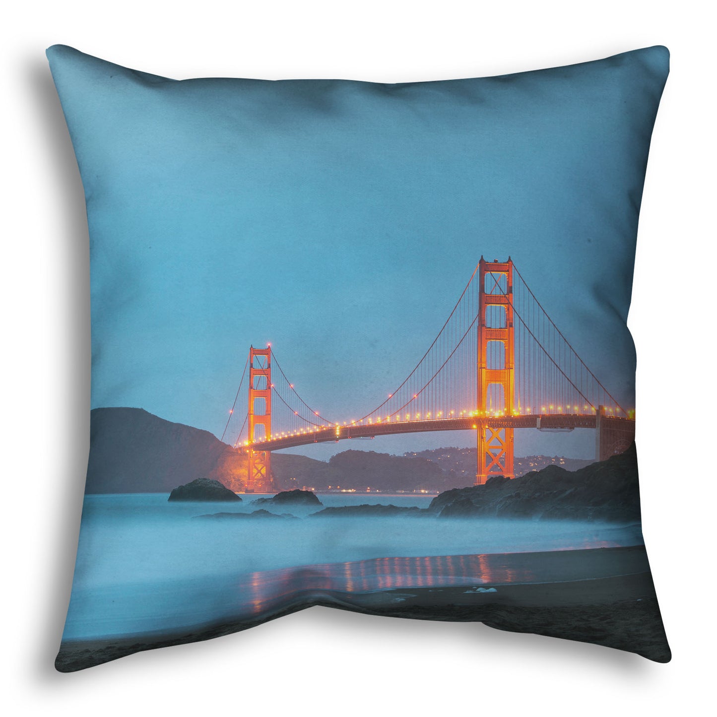 A throw pillow designed with a photo from Baker Beach, San Francisco, looking out over the water at the Golden Gate Bridge.