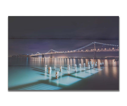 Photo of the Oakland Bay Bridge in San Francisco at night, taken from the Embarcadaro. Printed on a box board.