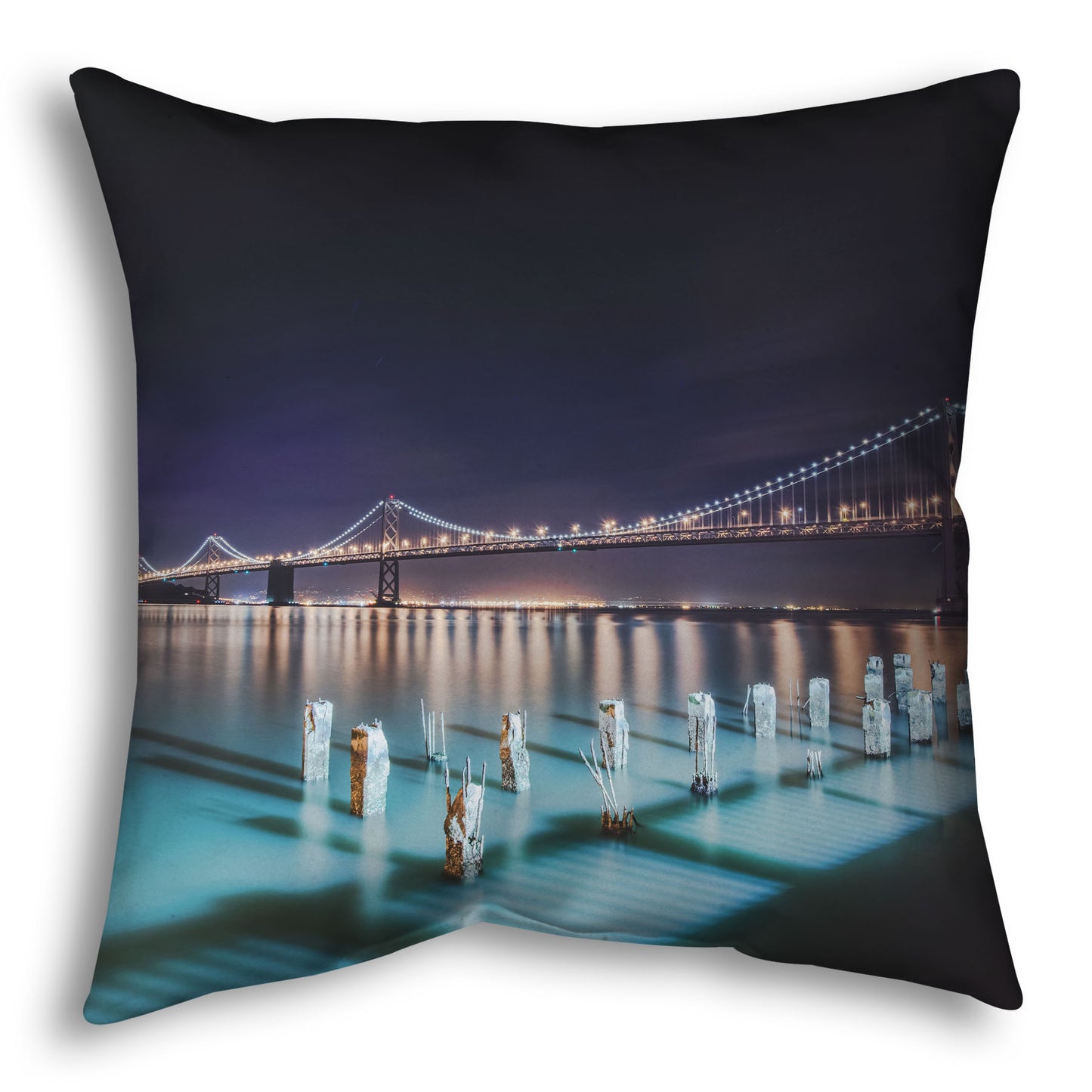 A throw pillow designed with a photo of the Oakland Bay Bridge in San Francisco at night, taken from the Embarcadero.