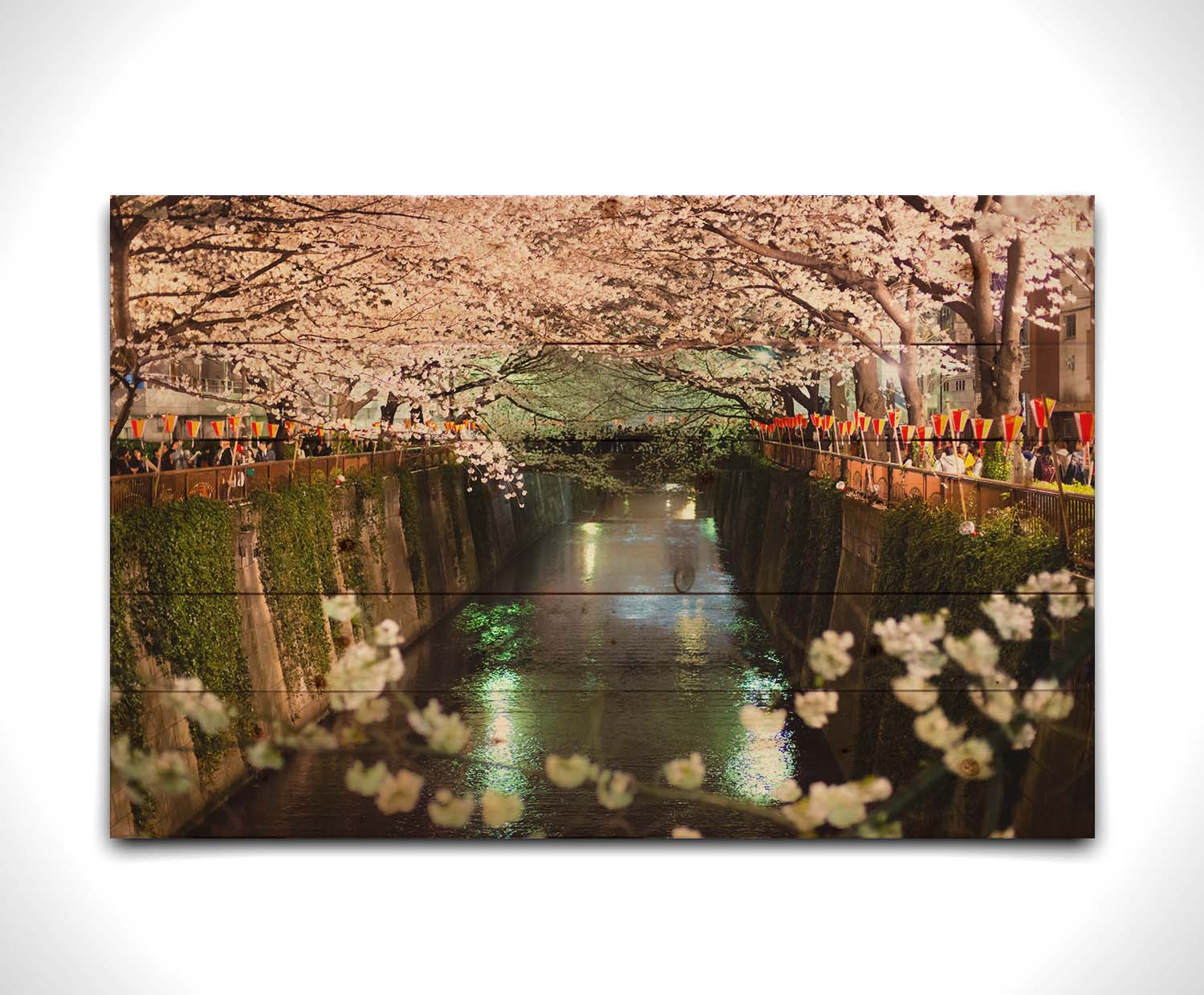 Photo of cherry blossom trees over a canal at Meguro River in Tokyo, Japan. Printed on a wood pallet.