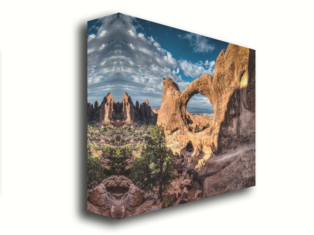 Photo of the Double O arch in the Devil's Garden at Arches National Park, Utah. The rocky arch is set against a bright blue sky. Printed on canvas.