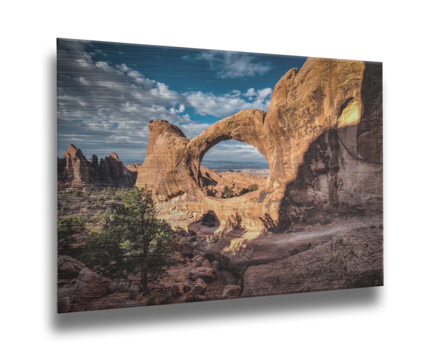 Photo of the Double O arch in the Devil's Garden at Arches National Park, Utah. The rocky arch is set against a bright blue sky. Printed on metal.