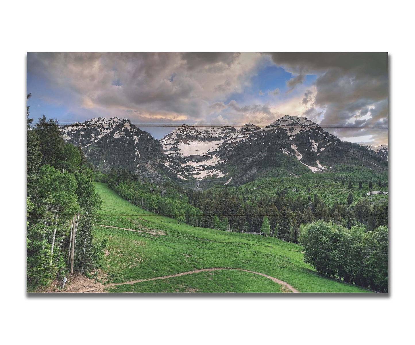 Photo of snowcapped mountains and rolling green hills and forestry, at the Sundance Ski Resort in Utah. Printed on a box board.