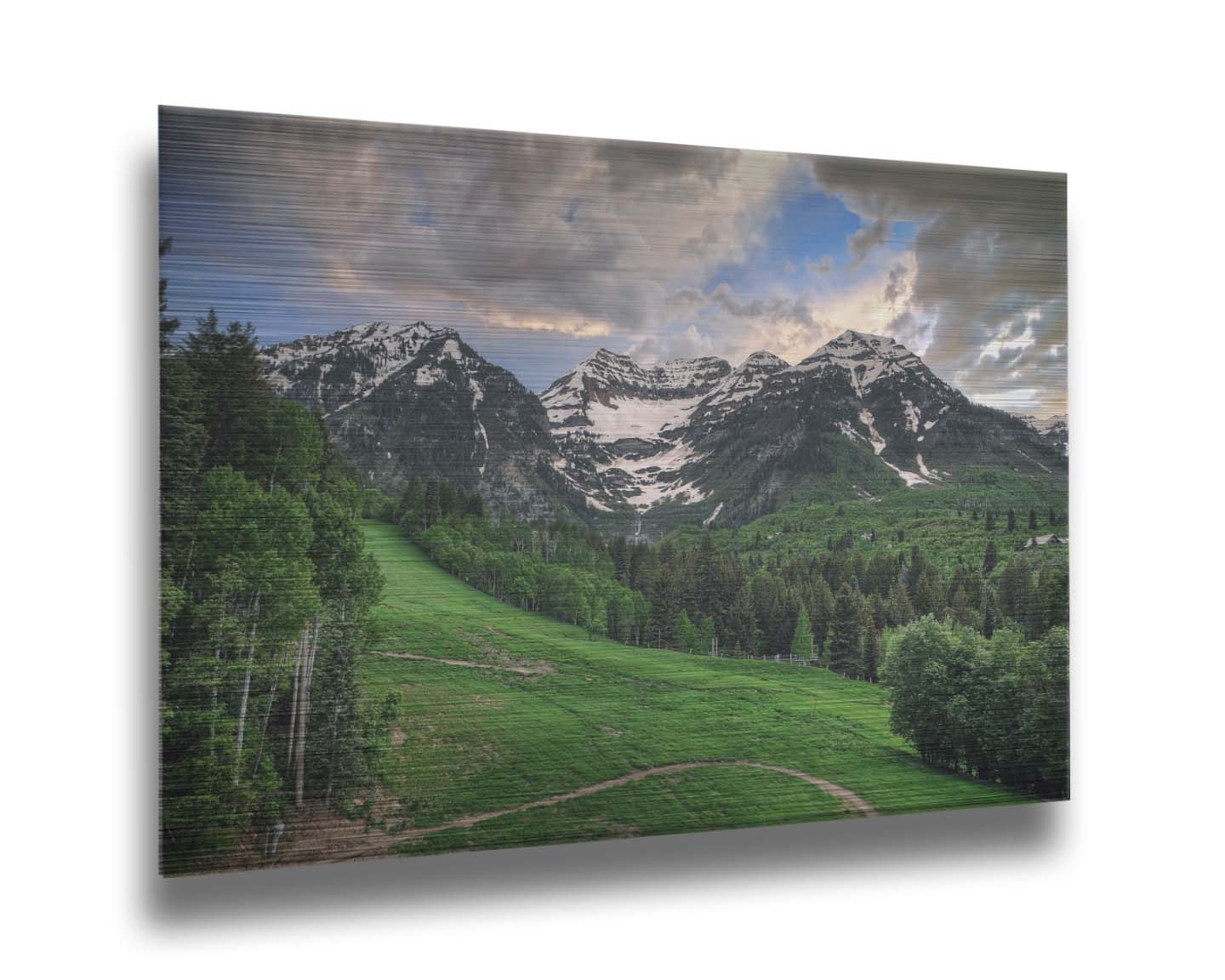 Photo of snowcapped mountains and rolling green hills and forestry, at the Sundance Ski Resort in Utah. Printed on metal.