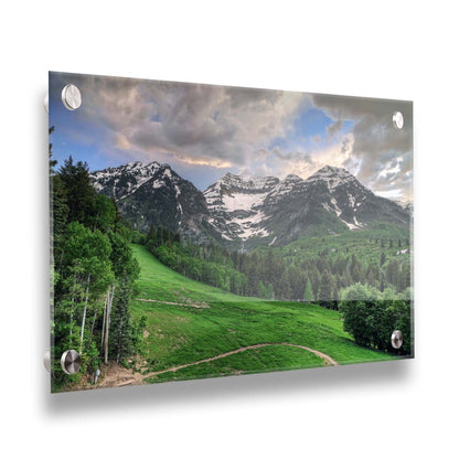 Photo of snowcapped mountains and rolling green hills and forestry, at the Sundance Ski Resort in Utah. Printed on acrylic.