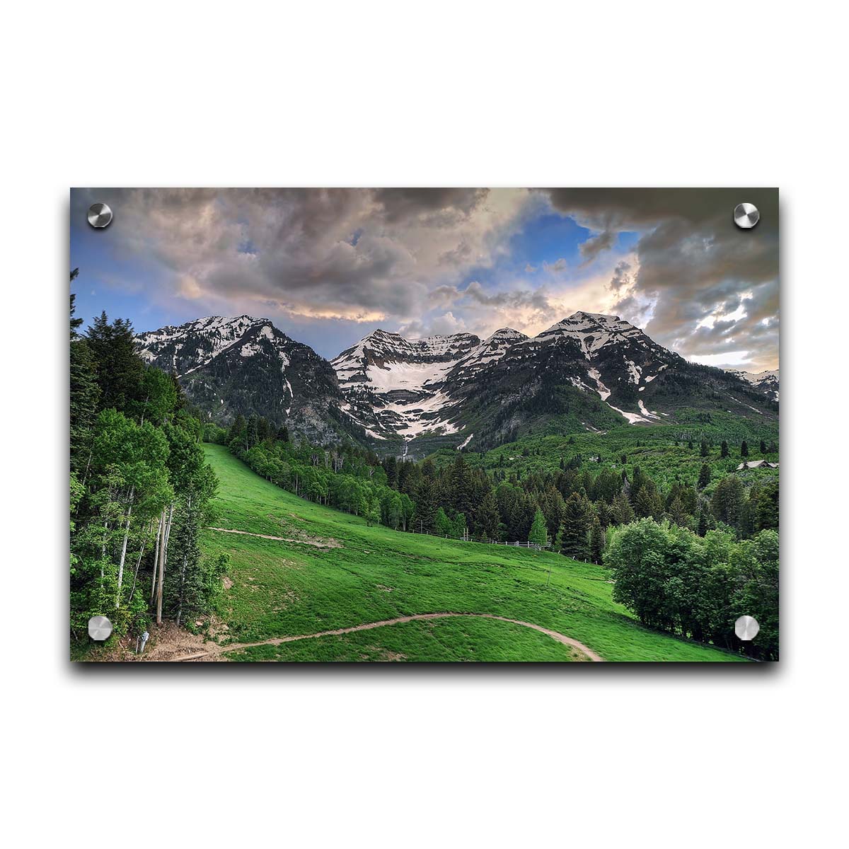 Photo of snowcapped mountains and rolling green hills and forestry, at the Sundance Ski Resort in Utah. Printed on acrylic.