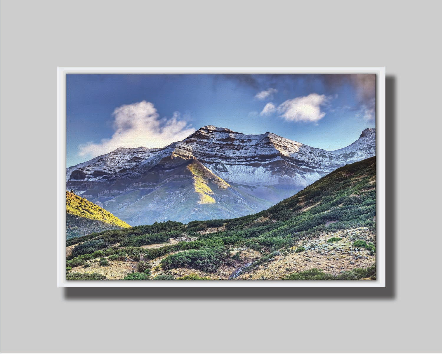 Photo of Mount Timpanogos in Utah, lightly dusted with snow against a blue sky. Printed on canvas in a float frame.