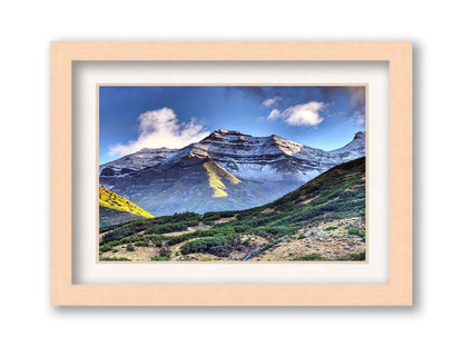 Photo of Mount Timpanogos in Utah, lightly dusted with snow against a blue sky. Printed on paper, matted, and framed.