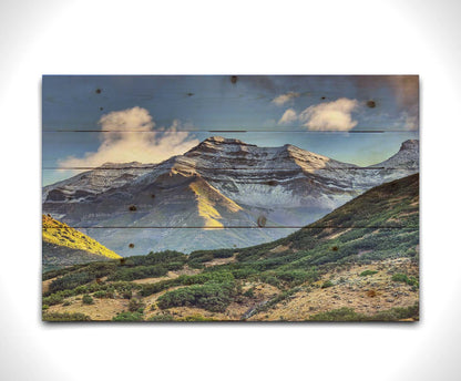 Photo of Mount Timpanogos in Utah, lightly dusted with snow against a blue sky. Printed on a wood pallet.