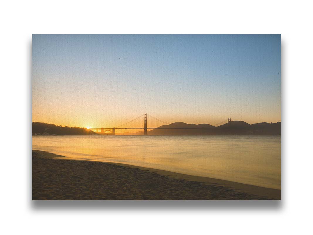 Photo of a golden sunset over the Golden Gate Bridge in San Francisco. Printed on canvas.