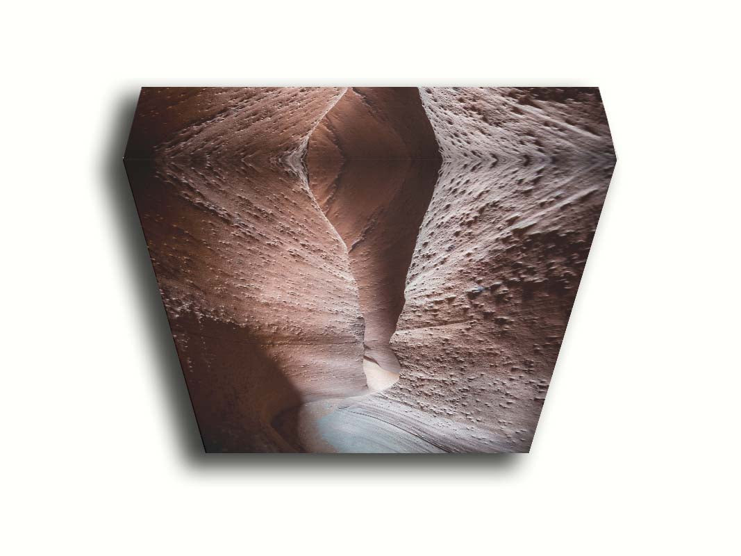 A photo of the slot canyon called Spooky near Escalante, Utah. It features a narrow crevice of lrough and smooth layers of stone. Printed on canvas.