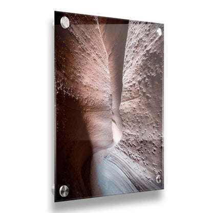 A photo of the slot canyon called Spooky near Escalante, Utah. It features a narrow crevice of lrough and smooth layers of stone. Printed on acrylic.