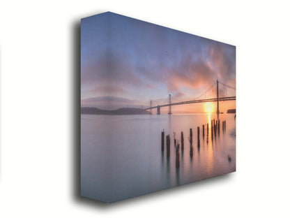 Photo of the Oakland Bay Bridge in San Francisco at sunrise, taken from the Embarcadaro. Printed on canvas.