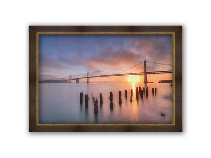 Photo of the Oakland Bay Bridge in San Francisco at sunrise, taken from the Embarcadaro. Printed on canvas and framed.