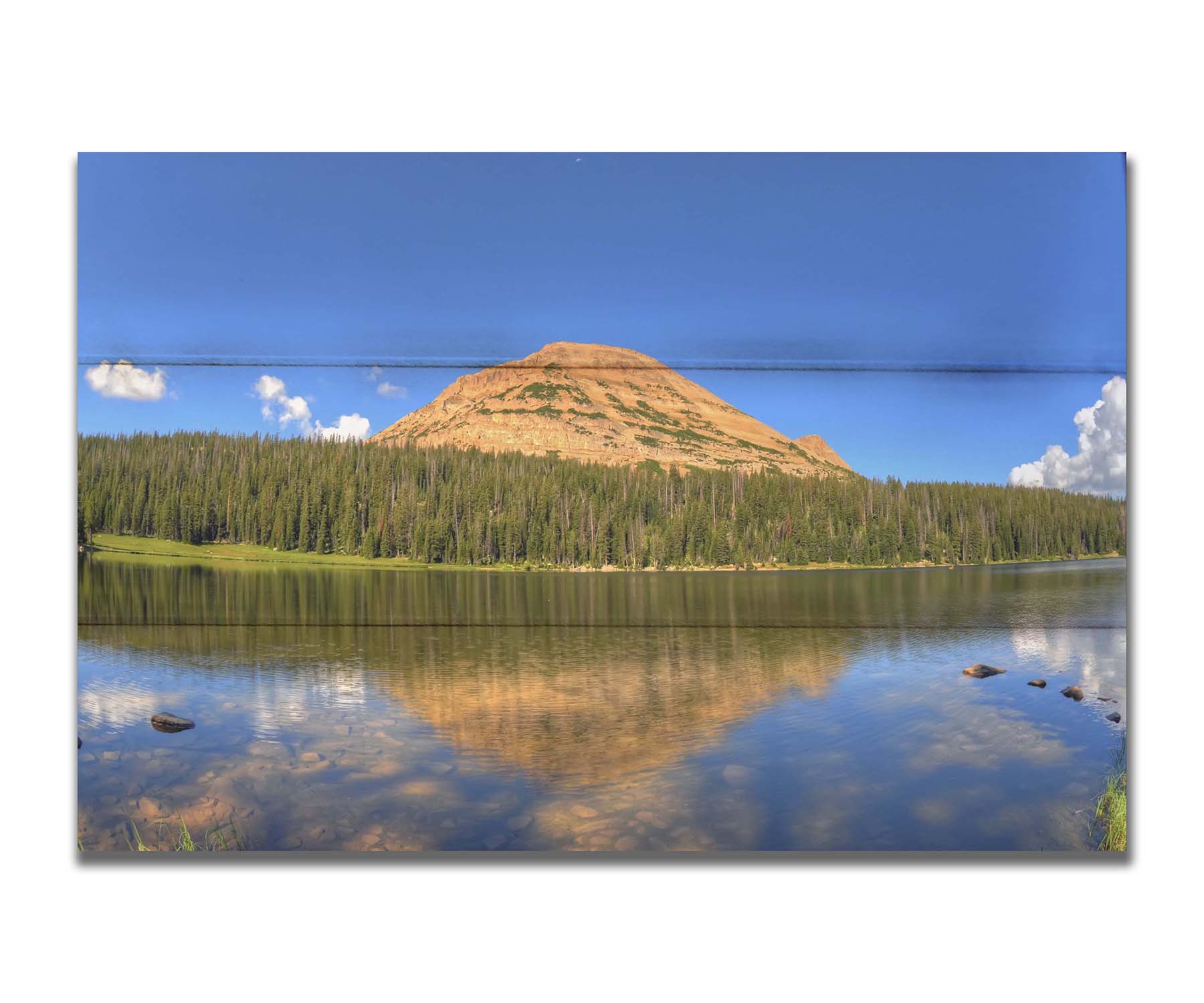 Photo of Mirror Lake in Utah. A mountain, forest, blue sky, and fluffy clouds are reflected on the lakewater. Printed on a box board.