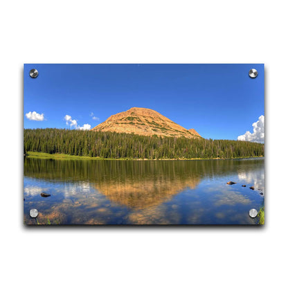 Photo of Mirror Lake in Utah. A mountain, forest, blue sky, and fluffy clouds are reflected on the lakewater. Printed on acrylic.