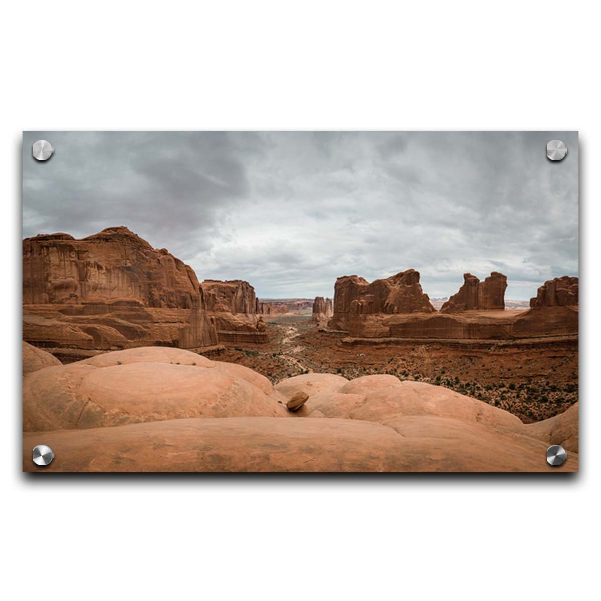 A photograph of Park Avenue at Arches National Park, looking out between rocky plateaus. Printed on acrylic.