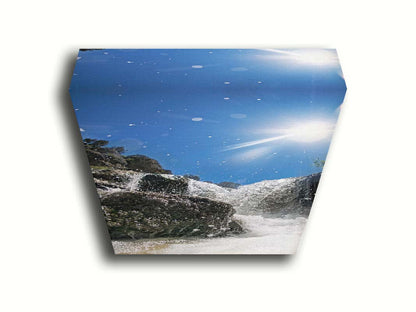 A photo looking up at the waterfalls filling the mountain hotsprings in Utah. The sky is clear and vibrant blue. Printed on canvas.