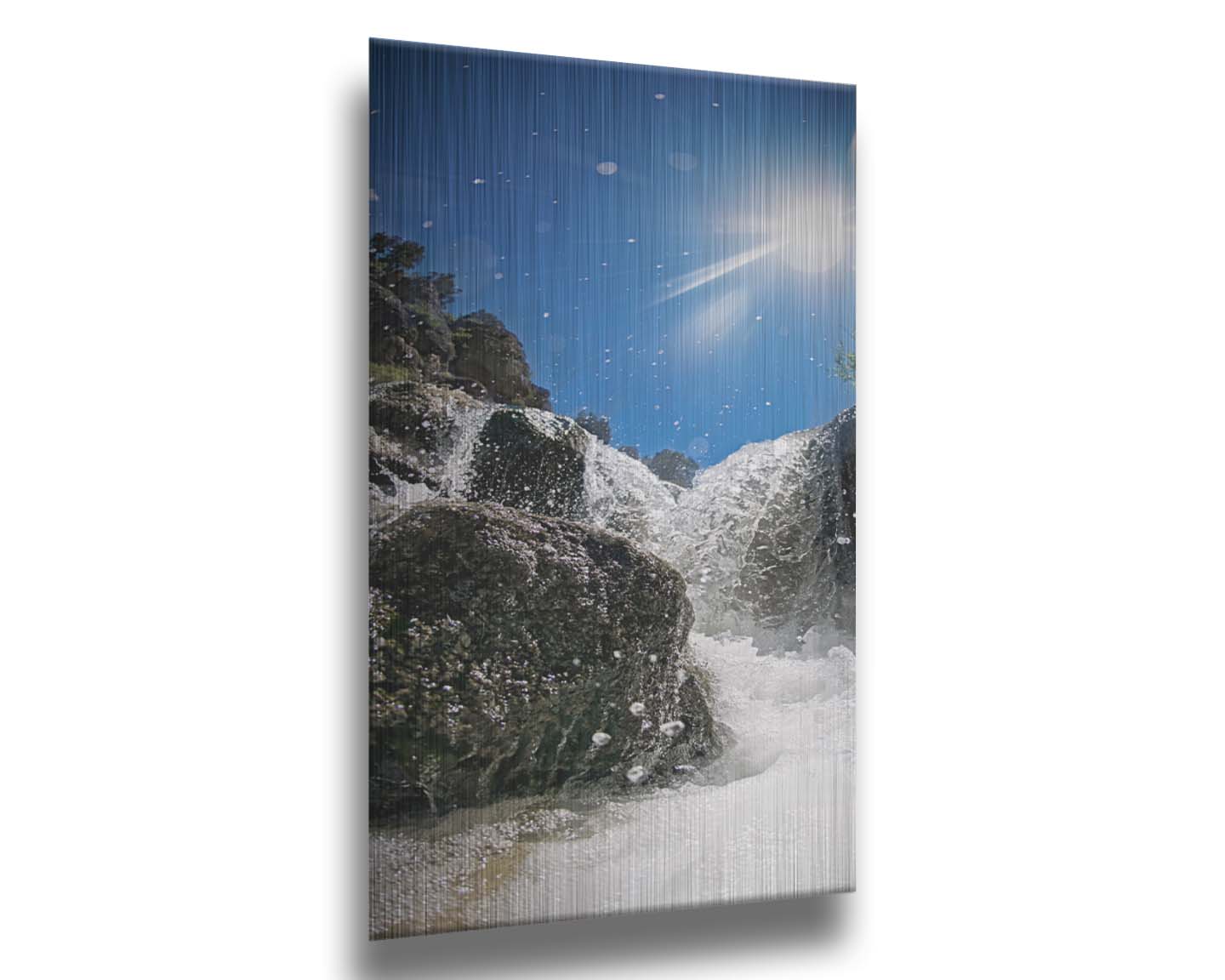 A photo looking up at the waterfalls filling the mountain hotsprings in Utah. The sky is clear and vibrant blue. Printed on metal.