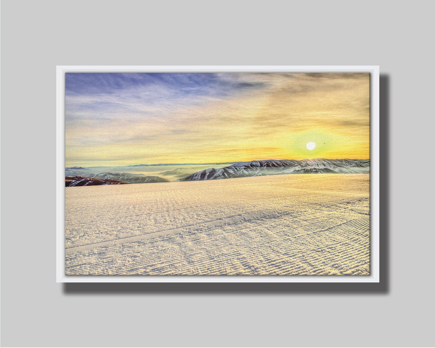 A photo of the sunrise over Sundance Ski Resort. The sun creates a yellow reflective glow on the freshly groomed ski slope. Printed on metal.