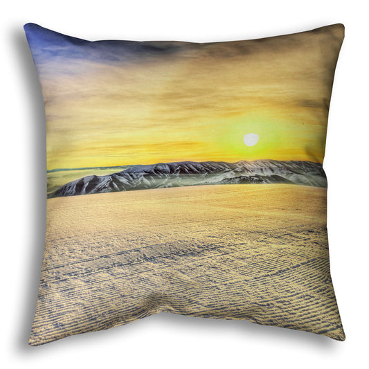 A throw pillow designed with a photo of the sunrise over a freshly groomed ski slope at Sundance Ski Resort.