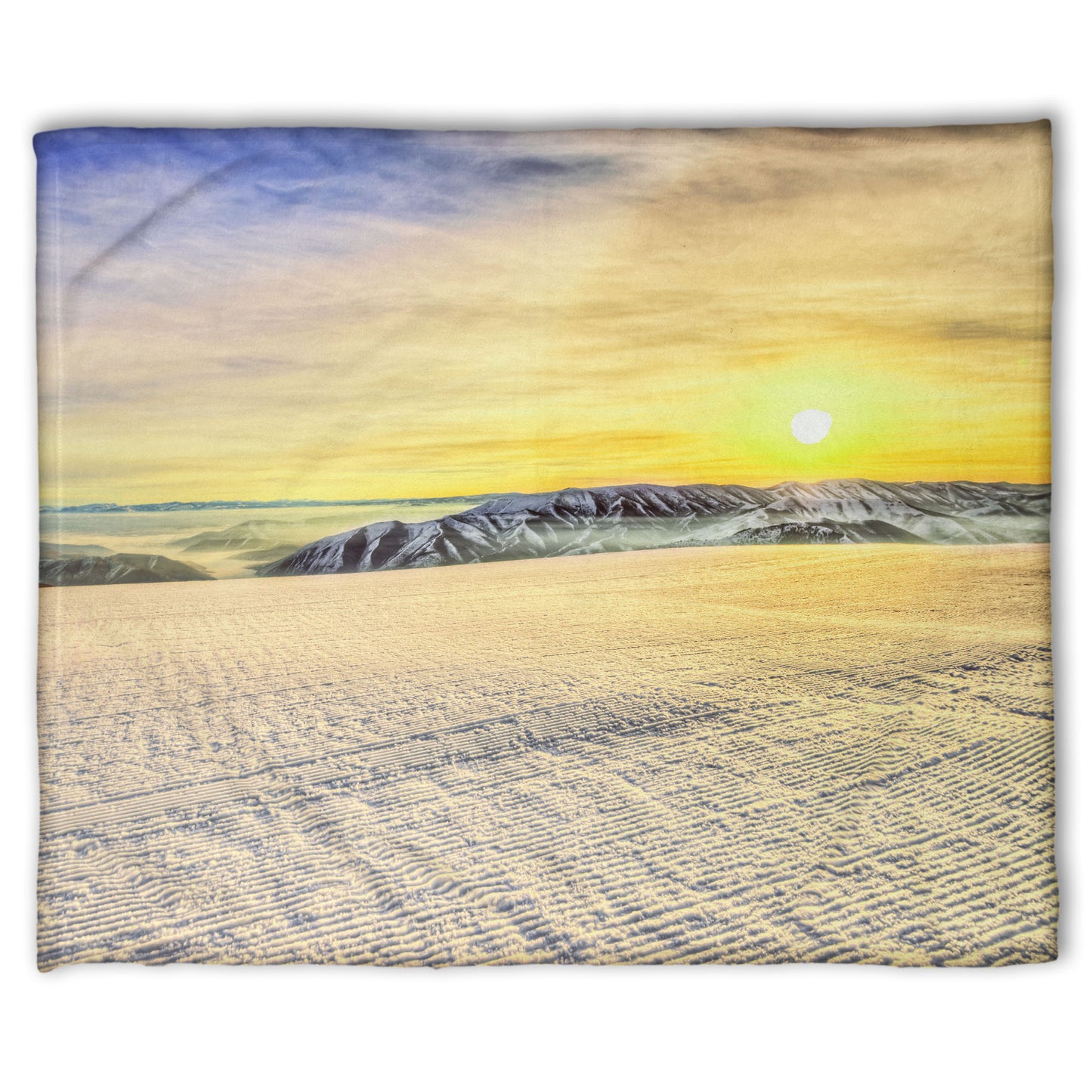 A coral fleece blanket designed with a photo of the sunrise over a freshly groomed ski slope at Sundance Ski Resort.