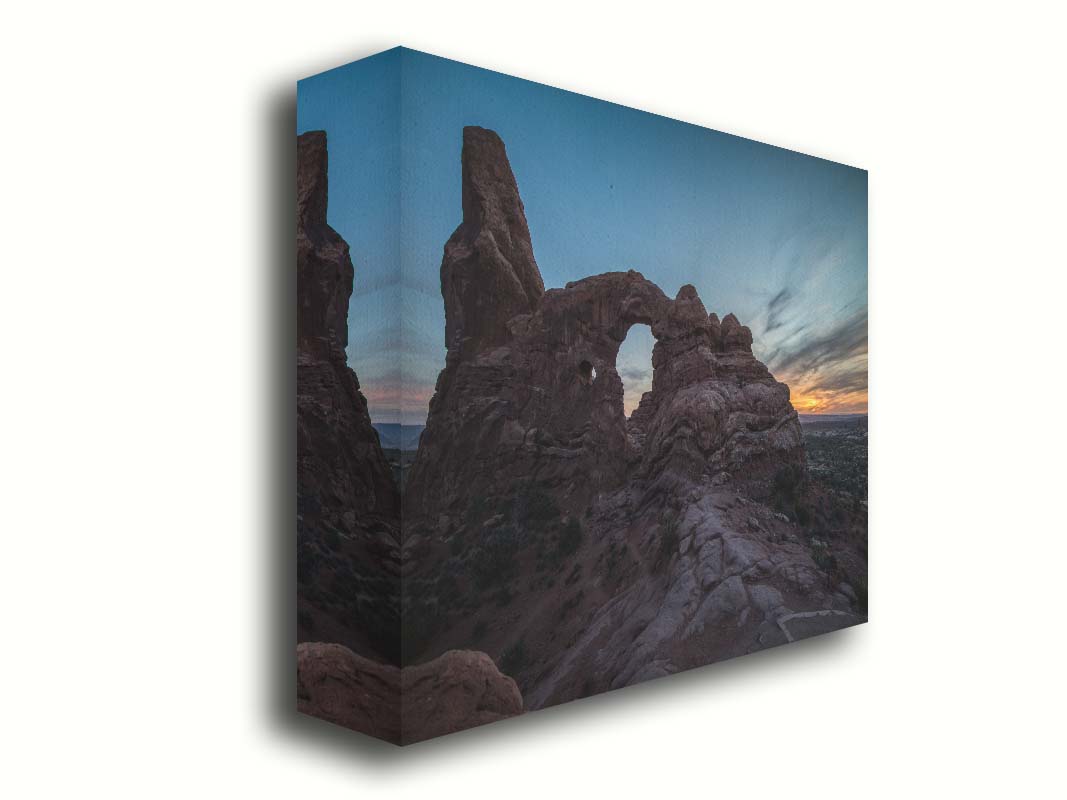 A photo of the Turret Arch rock formation at Arches National Park, Utah during sunset. Printed on canvas.