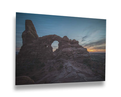 A photo of the Turret Arch rock formation at Arches National Park, Utah during sunset. Printed on metal.