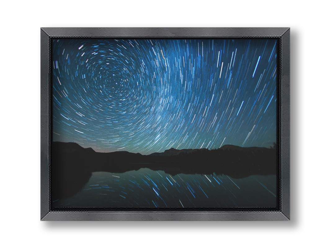 A photo of the Perseid Meteor shower reflecting off of Mirror Lake in Utah. Printed on canvas and framed.