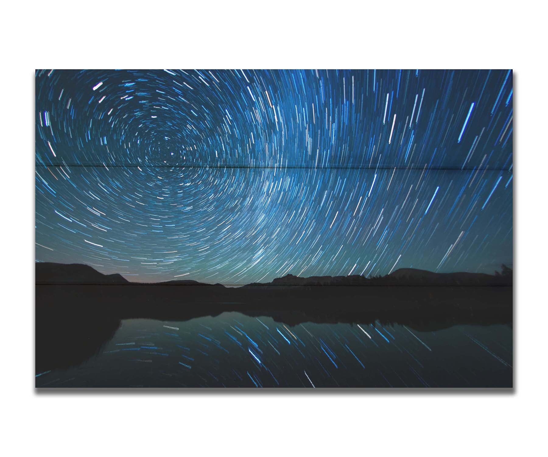 A photo of the Perseid Meteor shower reflecting off of Mirror Lake in Utah. Printed on a box board.