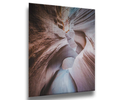 A photo looking through Peek-A-Boo slot canyon near Escalante, Utah. The wavy layers of sandstone have an unusual, surreal appearance. Printed on metal.