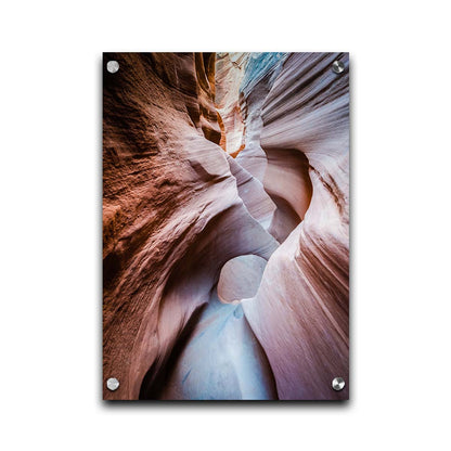 A photo looking through Peek-A-Boo slot canyon near Escalante, Utah. The wavy layers of sandstone have an unusual, surreal appearance. Printed on acrylic.