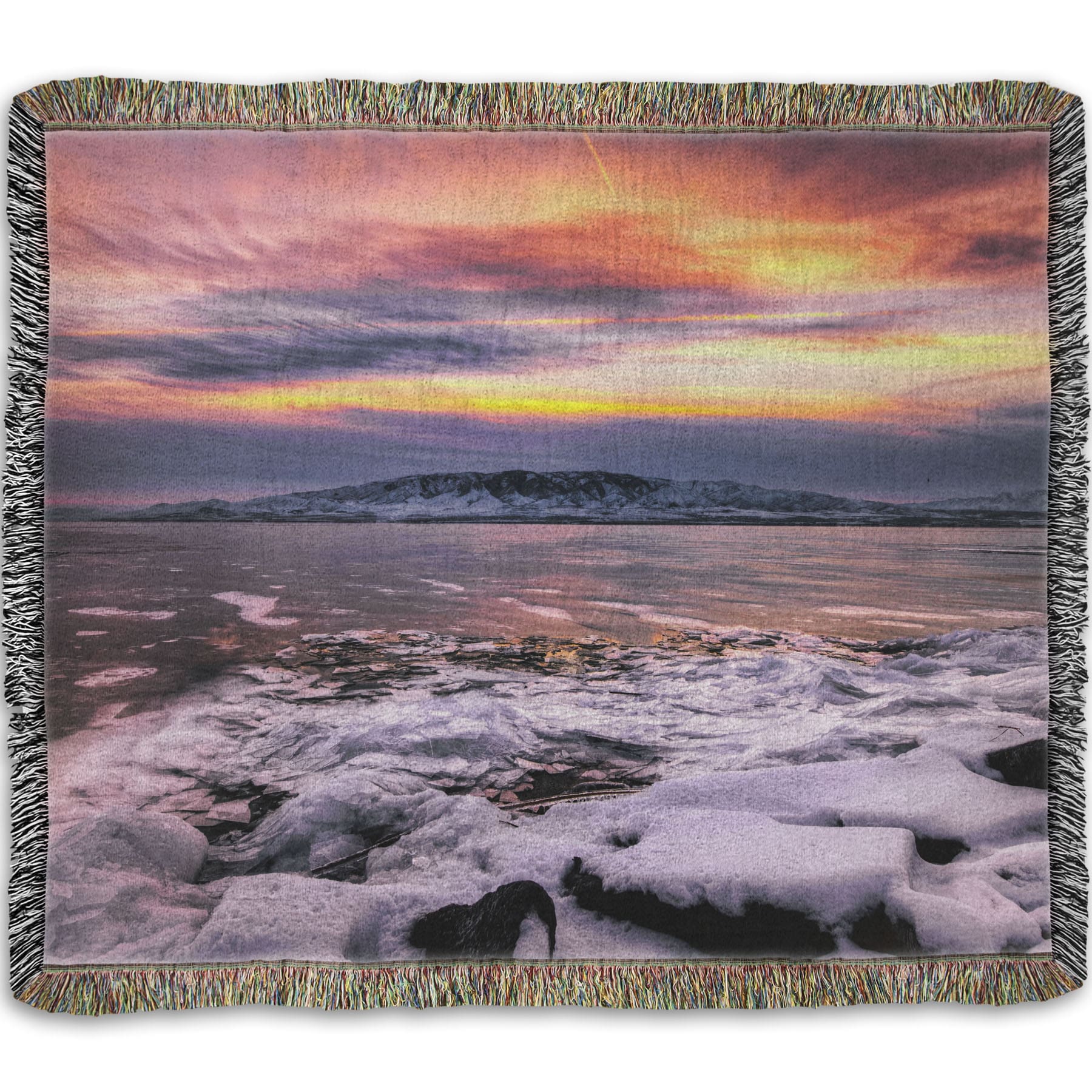 A woven throw blanket designed with the photo of a sunset over an icy lake at Mount Timpanogos, Utah, one Christmas evening.