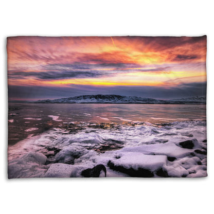 A coral fleece blanket designed with the photo of a sunset over an icy lake at Mount Timpanogos, Utah, one Christmas evening.