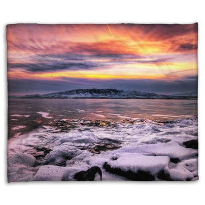 A coral fleece blanket designed with the photo of a sunset over an icy lake at Mount Timpanogos, Utah, one Christmas evening.