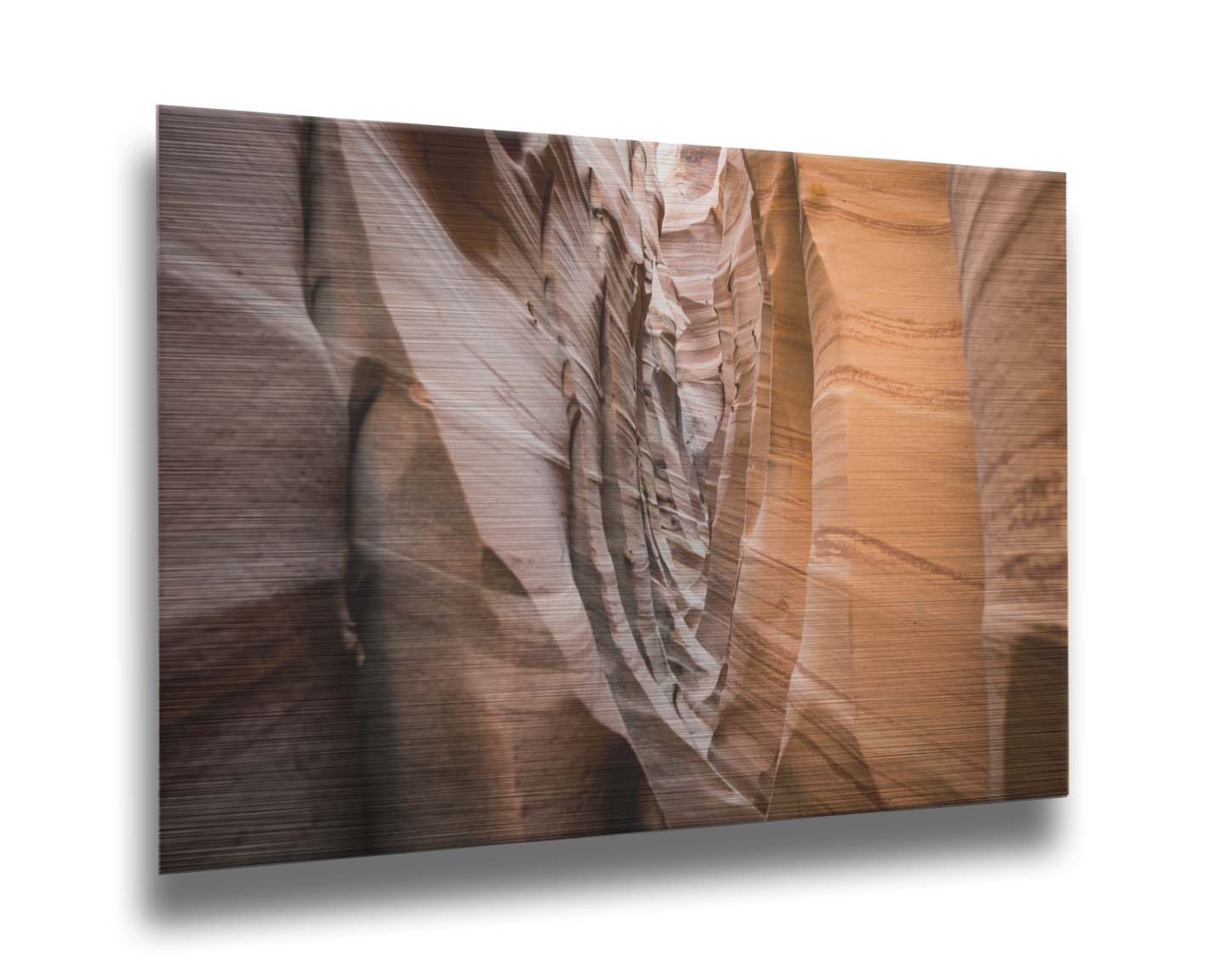 A photo of the Zebra Slot Canyon at Grand Staircase-Escalante National Monument, Utah. The red and orange sandstone stripes alternate in sharp waves down the length of the narrow passageway. Printed on metal.