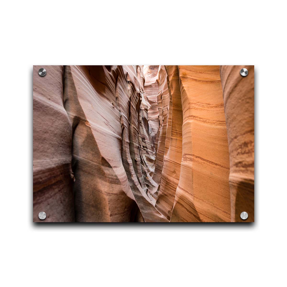 A photo of the Zebra Slot Canyon at Grand Staircase-Escalante National Monument, Utah. The red and orange sandstone stripes alternate in sharp waves down the length of the narrow passageway. Printed on acrylic.