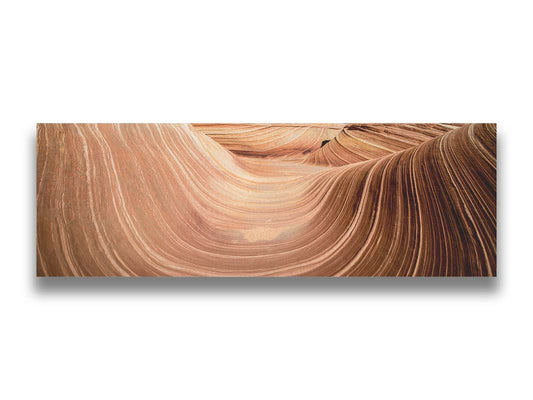 A panoramic photo of the Wave rock formation, at the Coyote Buttes North area of the Utah-Arizona border. The stripes of reddish-brown stone create a unique wave-like shape. Printed on canvas.