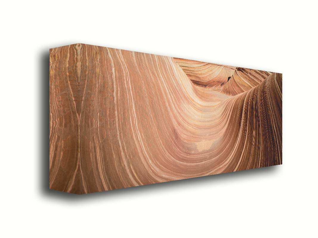 A panoramic photo of the Wave rock formation, at the Coyote Buttes North area of the Utah-Arizona border. The stripes of reddish-brown stone create a unique wave-like shape. Printed on canvas.