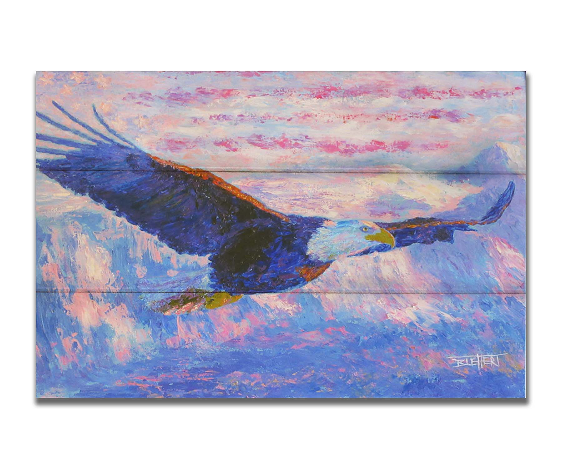 Painting of an eagle flying over the mountains using a red, white, and blue themes palette. Printed on a box board.