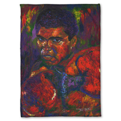 A coral fleece blanket designed with a painting of boxer Muhammad Ali wearing boxing gloves in a fighting stance.