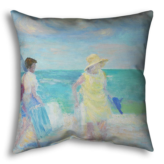 A throw pillow designed with a painting of two people on the beach, carrying towels and chairs and umbrellas. The ocean is calm behind them as they walk through the sand.