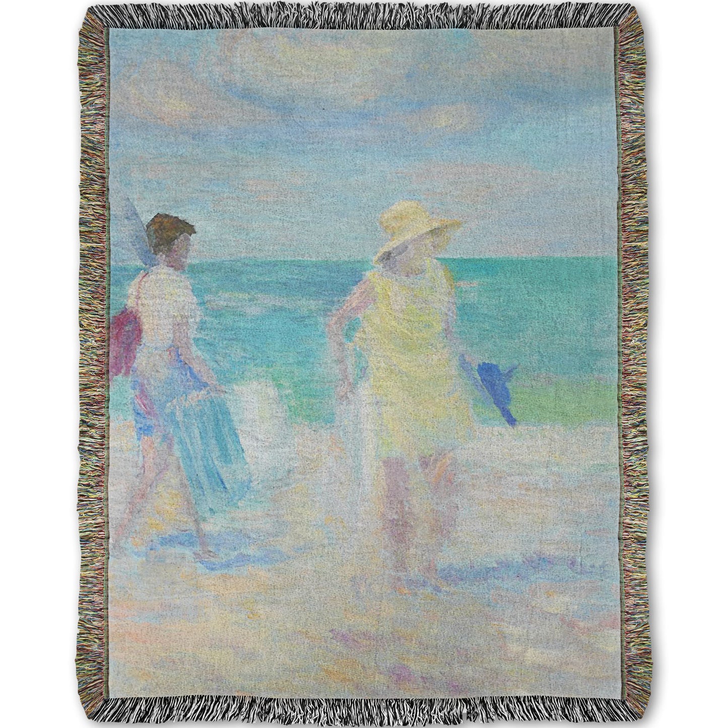 A woven throw blanket designed with a painting of two people on the beach, carrying towels and chairs and umbrellas. The ocean is calm behind them as they walk through the sand.